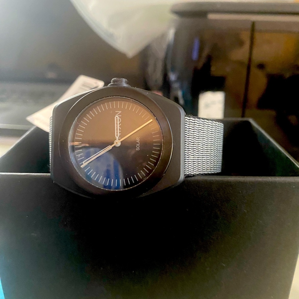 Nixon Black and Silver Timepiece